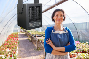 Portrait Of Mature Woman Working In Garden Center Greenhouse
